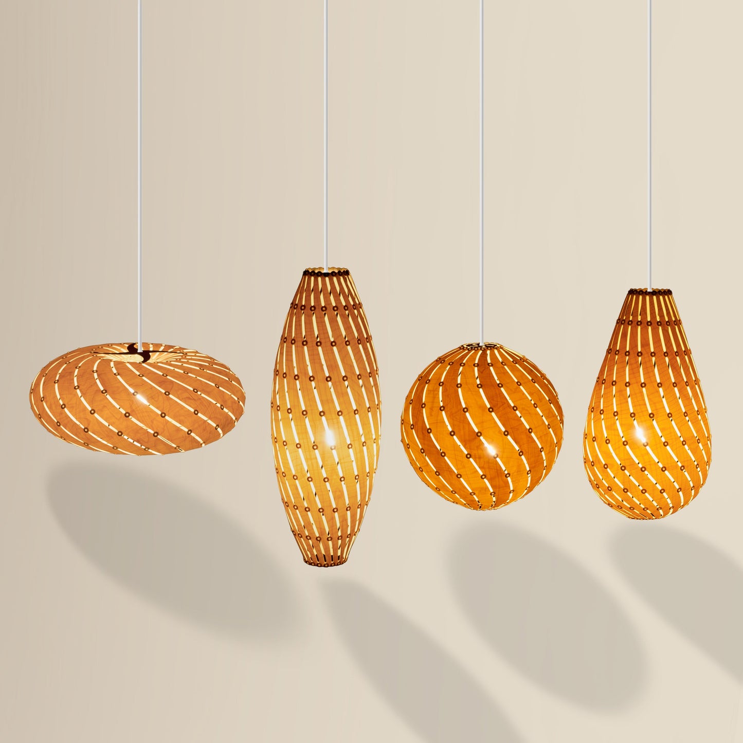 Ebb Family pendant lights in birch by David Trubridge